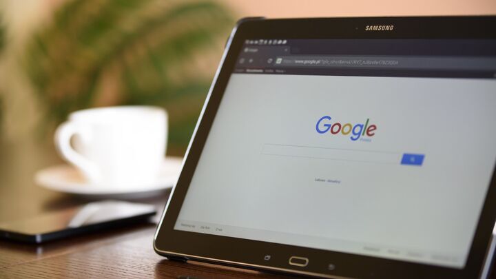 Tablet displaying Google search results” with descriptive alt‑text to improve accessibility and SEO