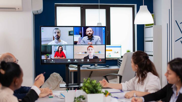 Distributed teams having a video meeting and sharing ideas