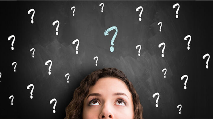 Woman with a lot of question marks