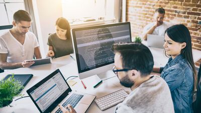 Programmer working in a software develop company office.