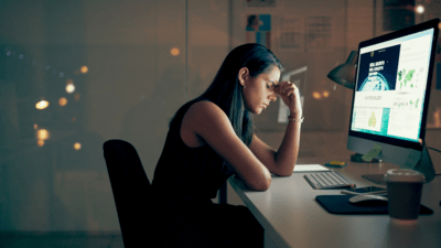 Stressed woman in front of a computer. 