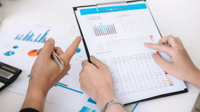 Worker pointing to data chart on a piece of paper