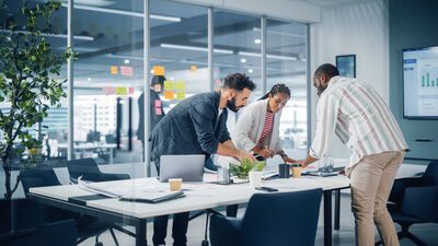 Diverse Team of Professional Businesspeople Meeting in the Office Conference Room.