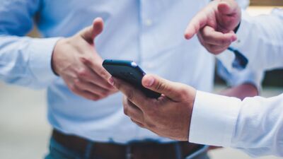 Image of hand holding a cell phone