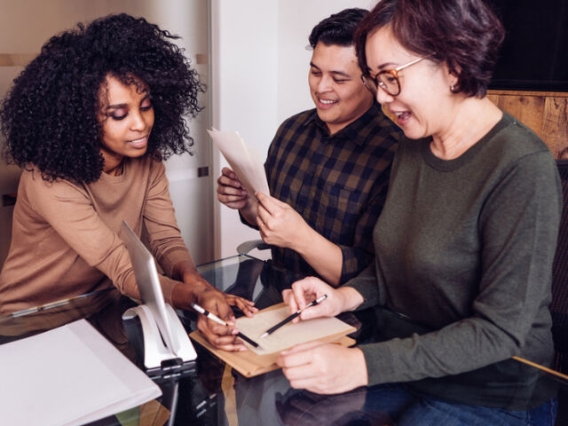 Marketing team reviewing content strategy and audience insights at office desk
