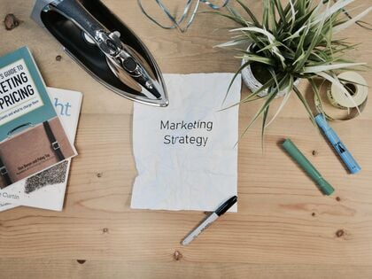 The word "marketing strategy" written on a piece of paper.