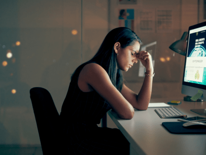 Stressed woman in front of a computer. 