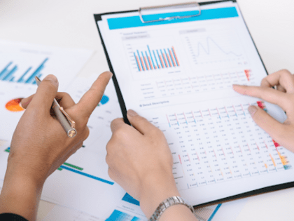 Worker pointing to data chart on a piece of paper