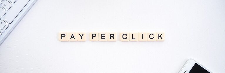 Scrabble tiles spelling out "Pay Per Click"