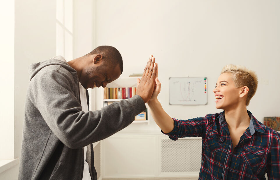 coworkers giving high five