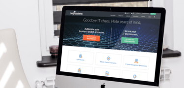 HelpSystems website shown on a desktop monitor