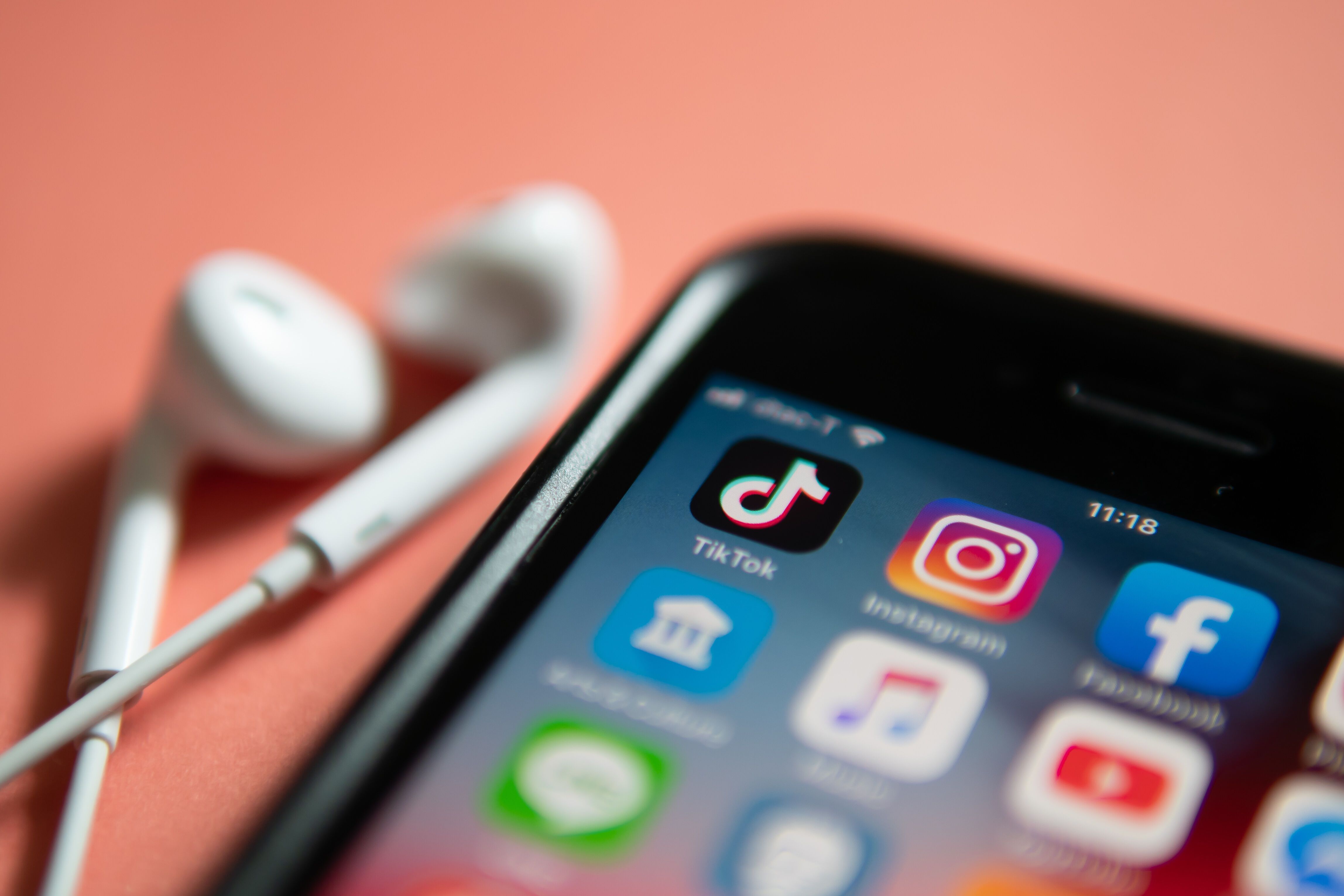 iPhone 7 showing its screen with TikTok and other social media application icons.
