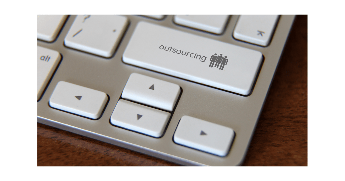 A laptop keyboard button with an Outsourcing icon.