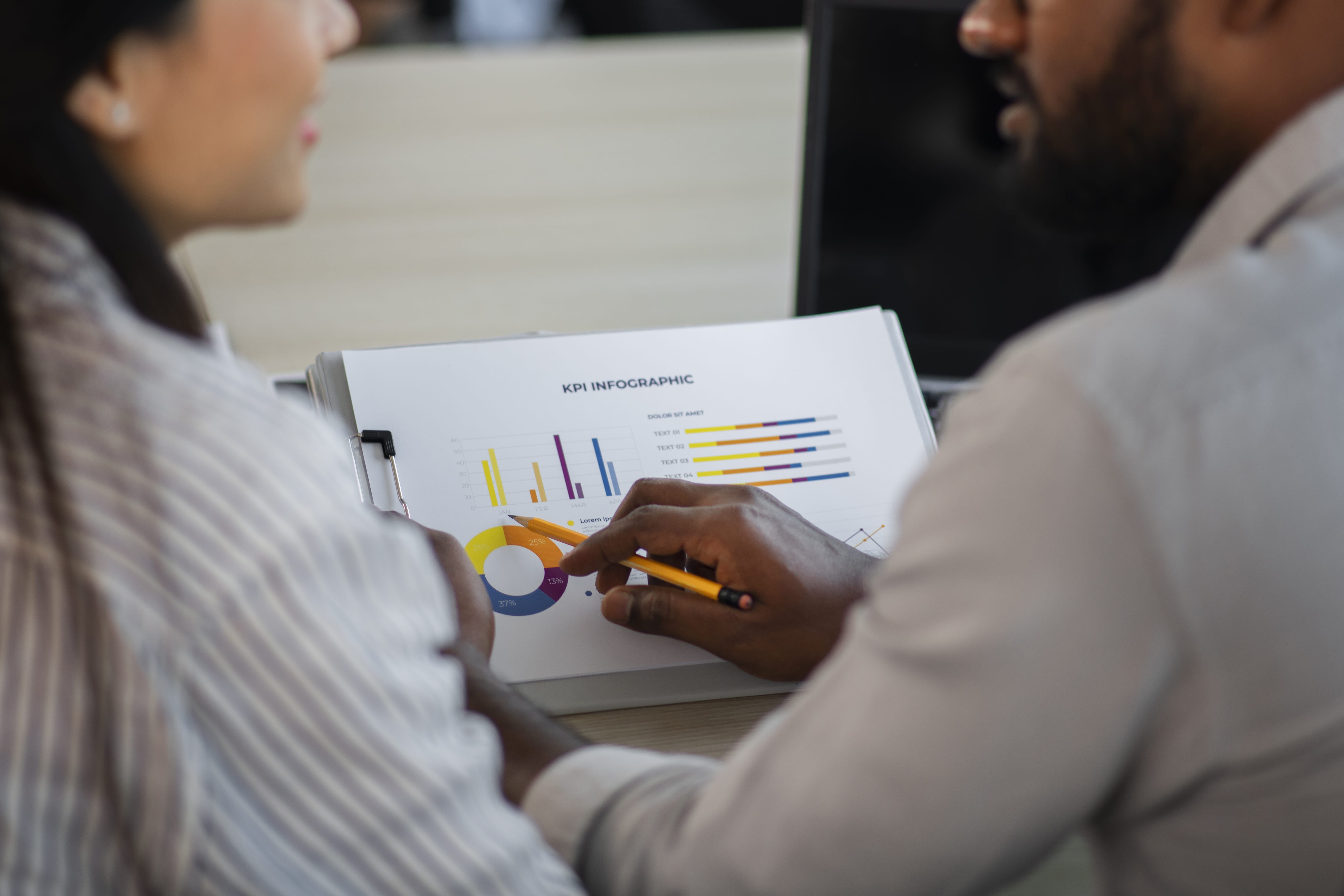 Coworkers tracking KPIs