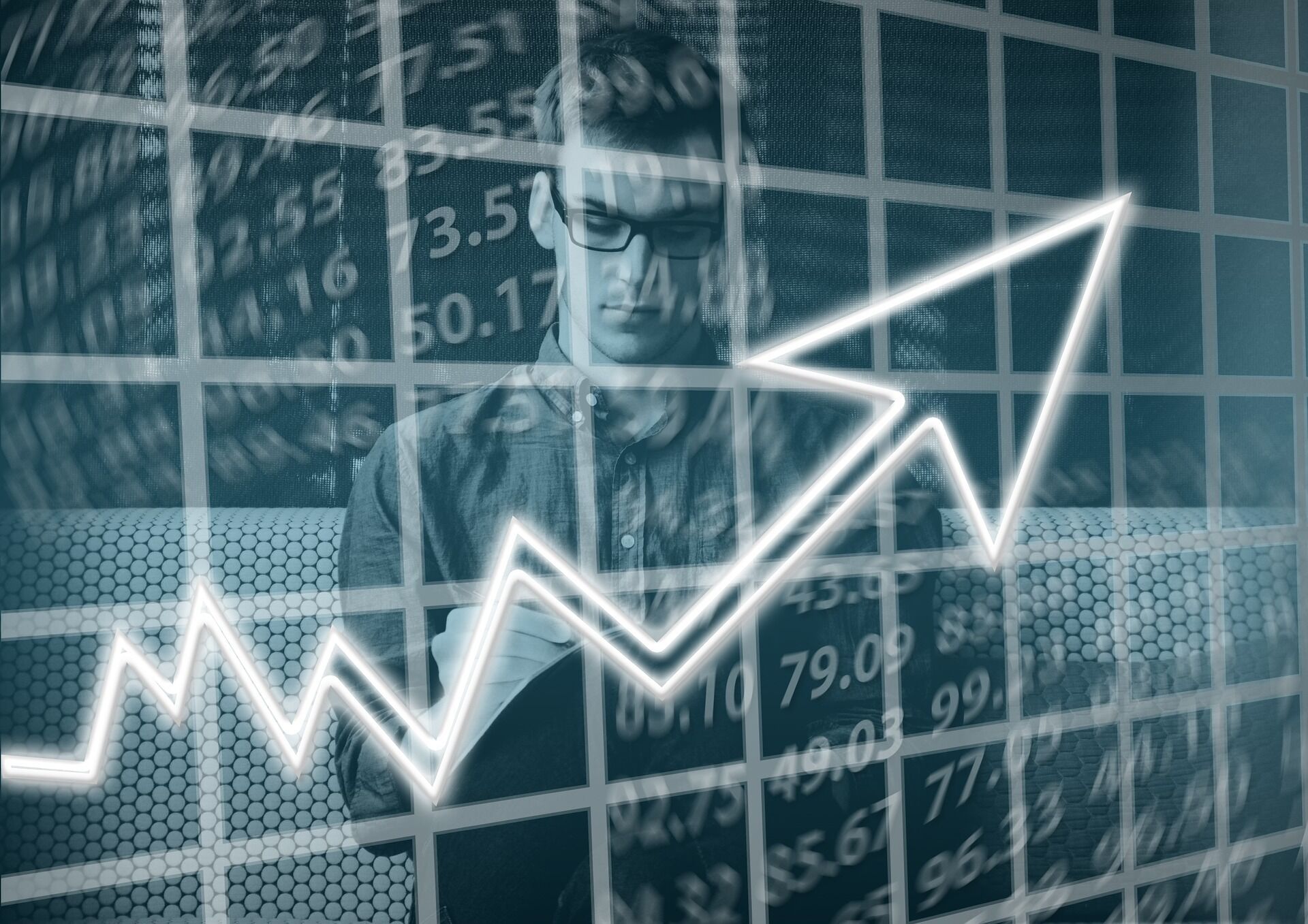 A man writing and a graph pointing upwards.