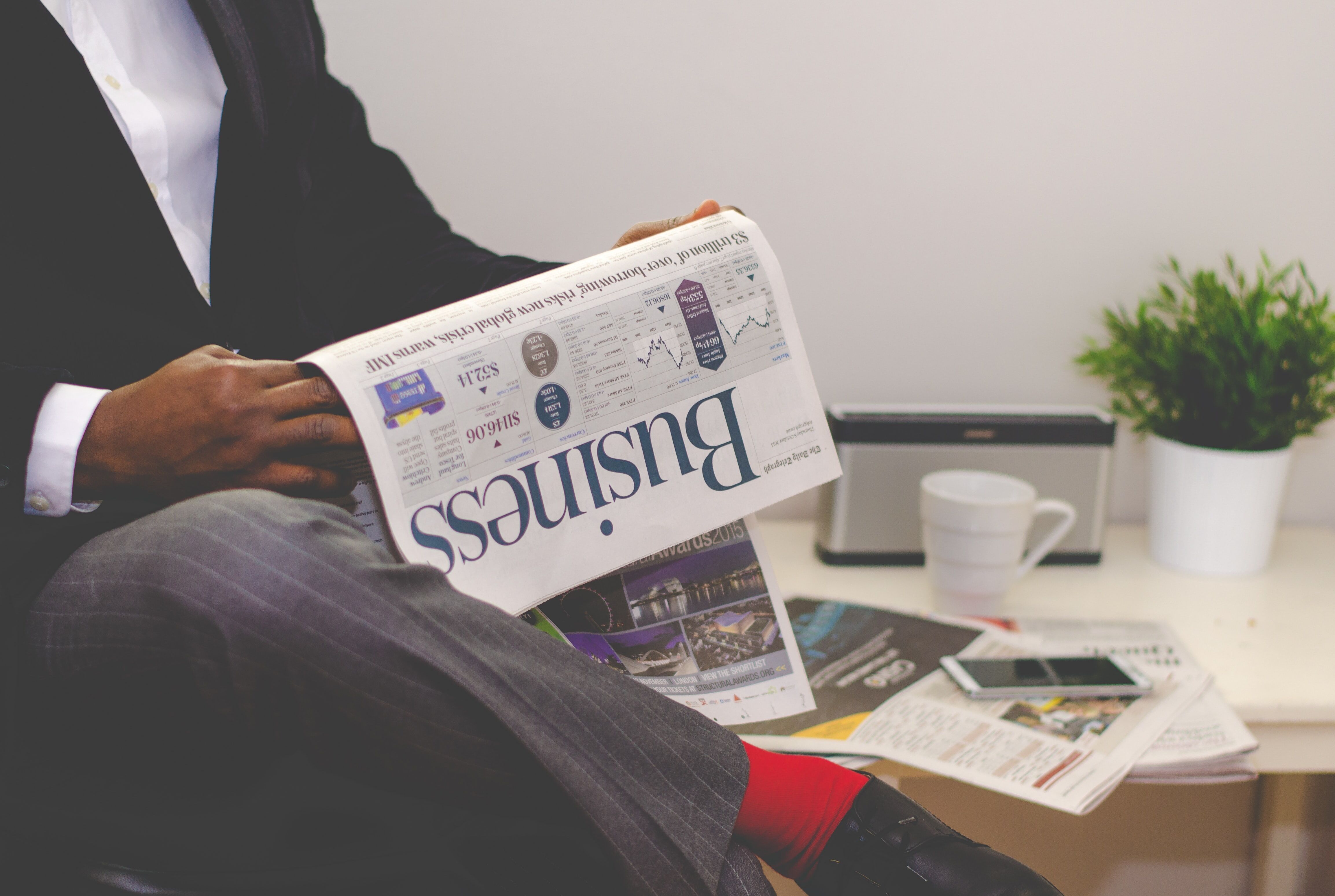 man reading a newspaper