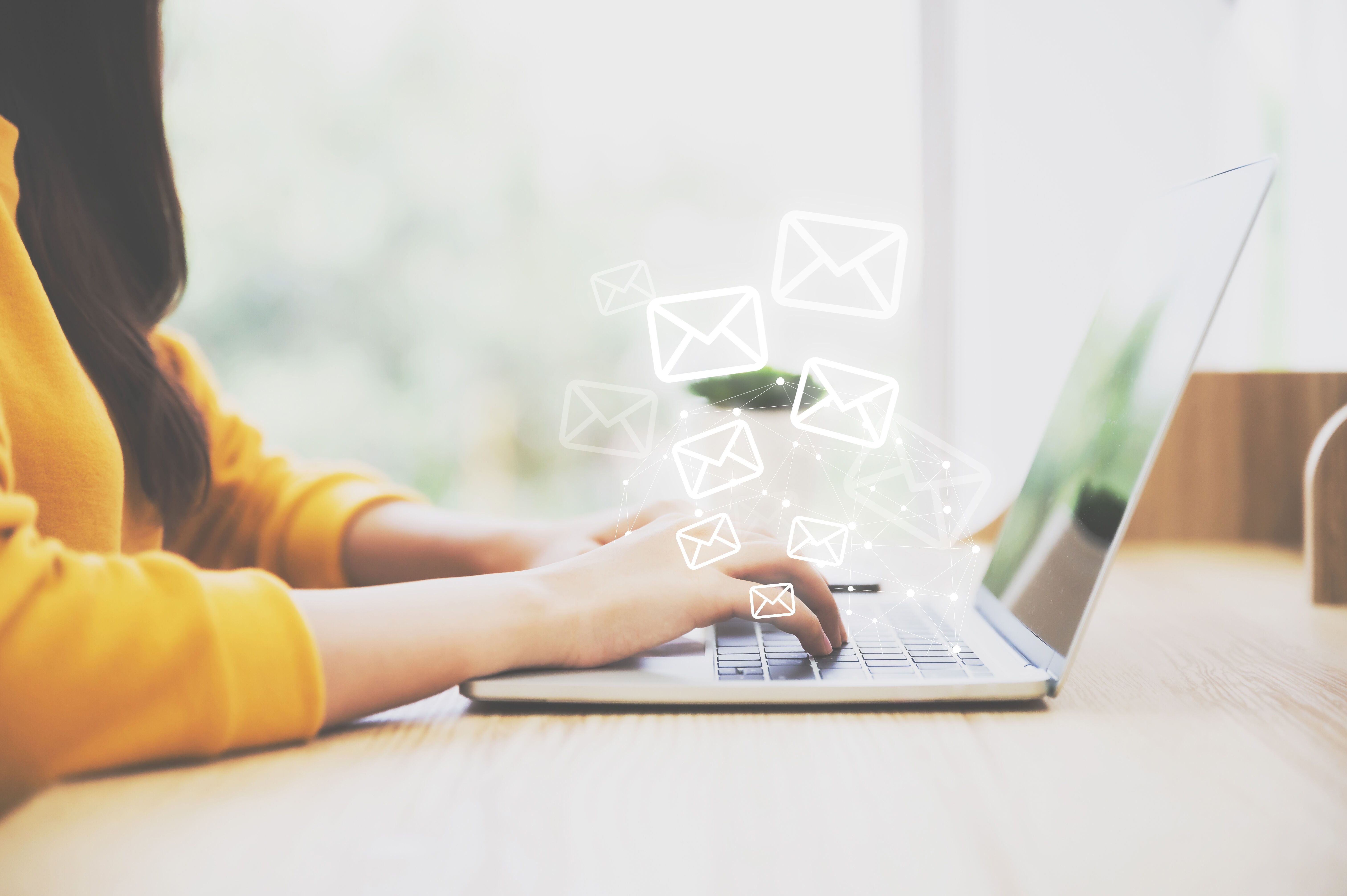 Woman hand using computer laptop pc with email icon