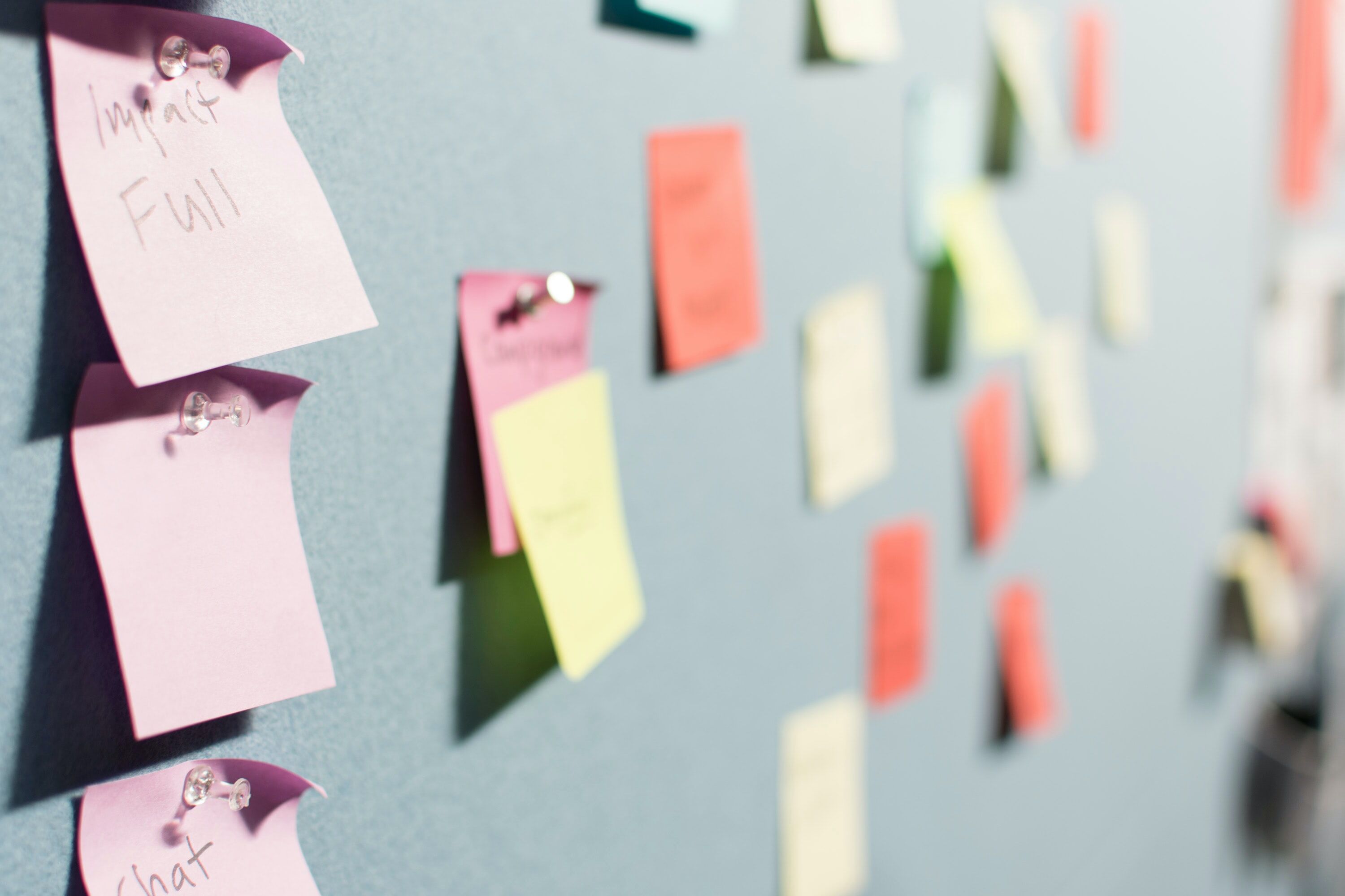 Post-it notes pinned to a board