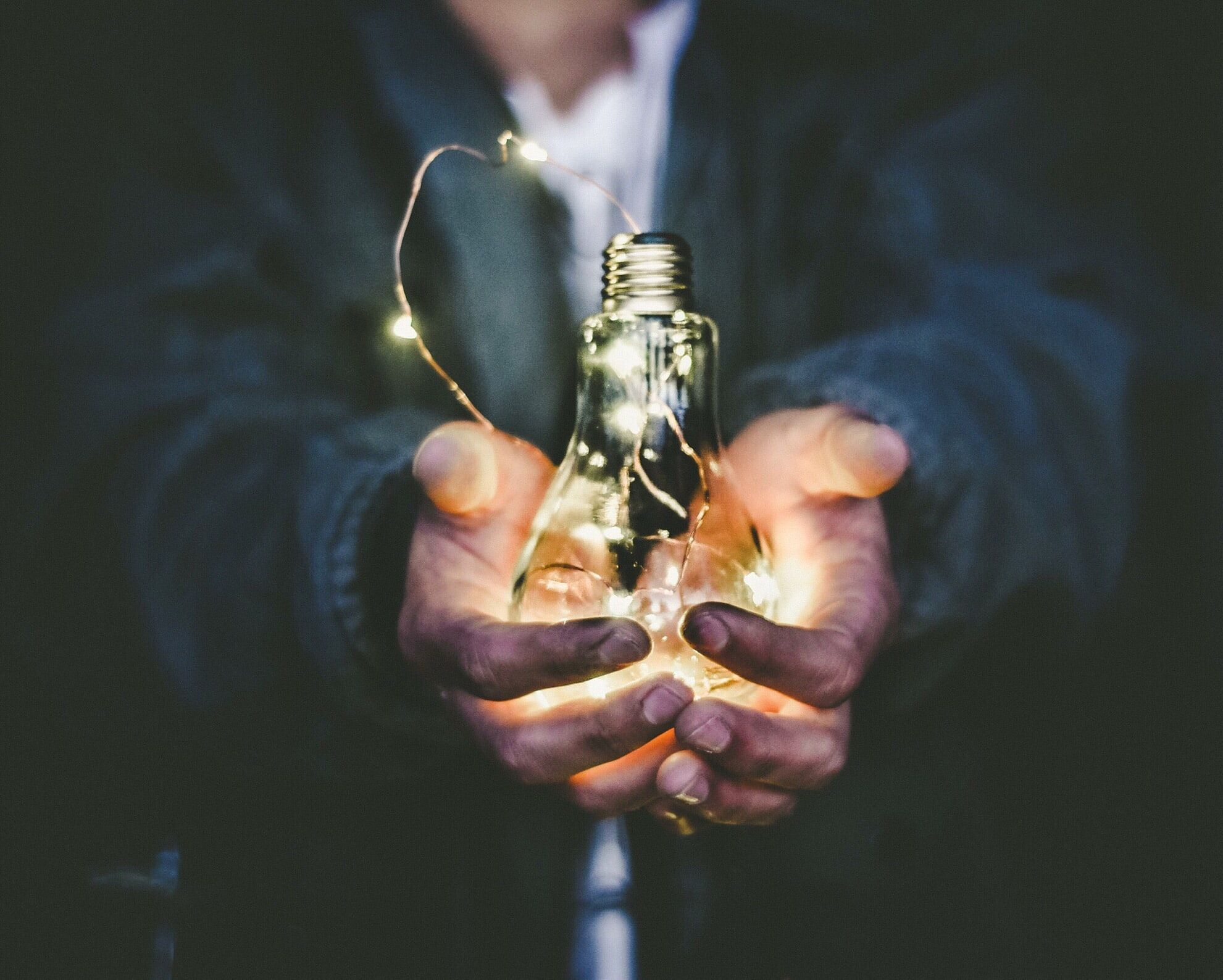 holding lightbulb