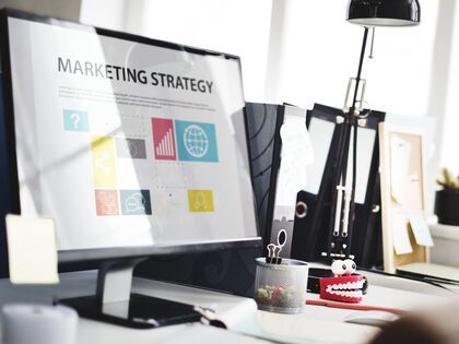Desktop with Marketing Strategy on display