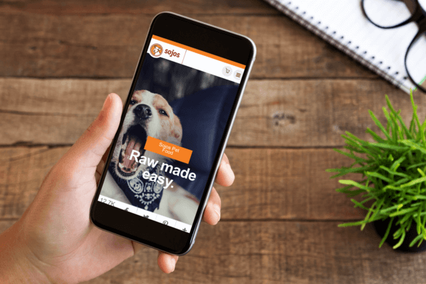 Sojos website shown on a smartphone