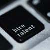 A computer keyboard key with "hire talent" as the label. 